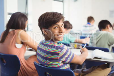 School kids doing homework in classroom