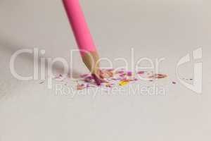 Pink colored pencil with broken tip