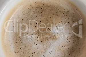White coffee cup with creamy froth