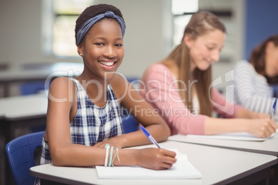 Student sitting at desk in classroom