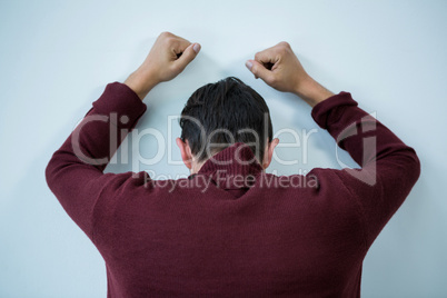 Stressed man leaning on wall