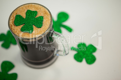 Mug of black beer and shamrock for St Patrick\s Day