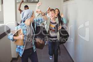 Group of classmate running in corridor