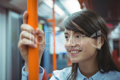 Executive smiling while traveling in train