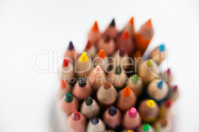 Close-up of colored pencils kept in a glass jar