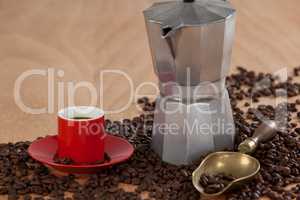 Coffee beans, coffee, coffeemaker and scoop