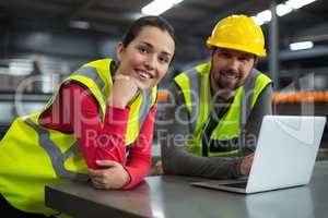 Factory workers using digital tablet