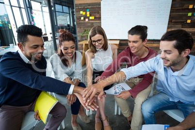 Team of businesspeople forming hand stack