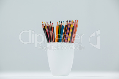 Colored pencils kept in cup