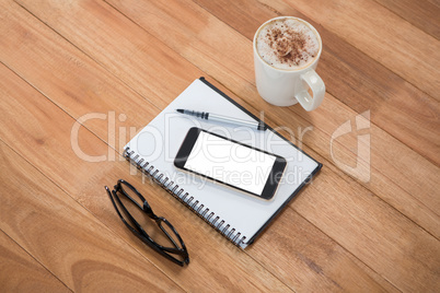 Coffee with organizer and mobile phone