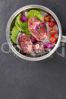 Sirloin chops and ingredients in frying pan