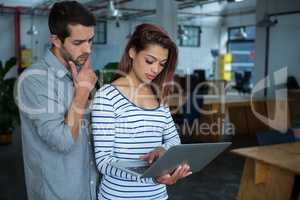 Man and woman using laptop