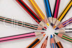 Close-up of colored pencils arranged in a circle