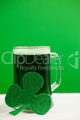 Mug of green beer and shamrock for St Patricks Day