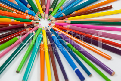 Close-up of colored pencils arranged in a circle