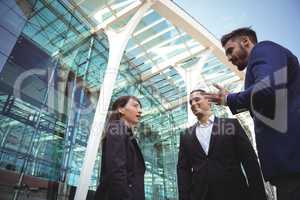 Businesses executives interacting with each other outside platform