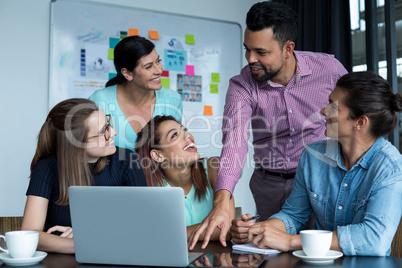 Businesspeople having discussion during meeting in people