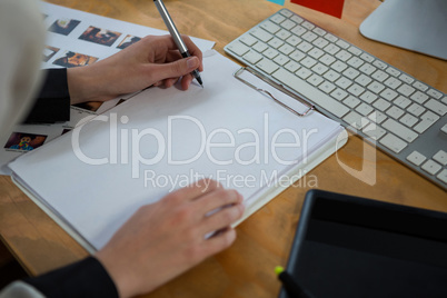 Female graphic designer working at desk