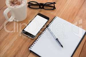 Coffee with organizer and mobile phone