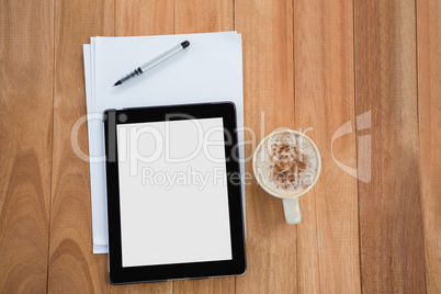 Coffee with digital tablet and paper