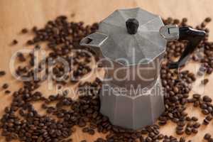 Metallic coffee maker with coffee beans