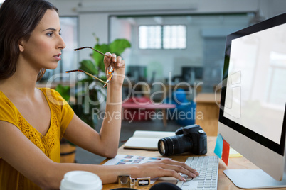 Female graphic designer working on computer