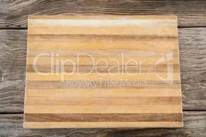 Wooden tray against wooden background