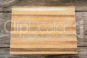 Wooden tray against wooden background