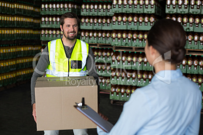 Factory workers interacting with each other