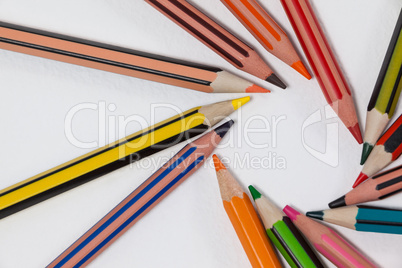 Close-up of colored pencils arranged in a circle