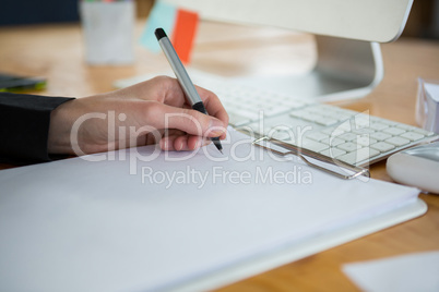 Female graphic designer working at desk