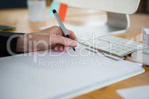 Female graphic designer working at desk