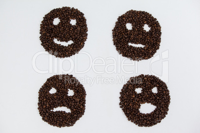 Coffee beans forming various faces