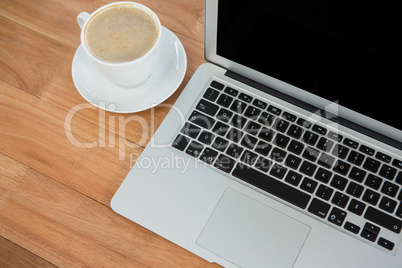 Cup of coffee and laptop