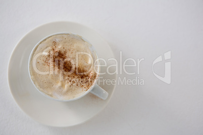 Close-up of coffee cup with creamy froth