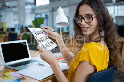 Female graphic designer working at desk