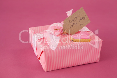 Close-up of gingerbread cookie with gift box