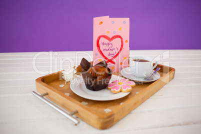Happy mothers day greeting card with tea and snacks