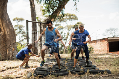 People receiving tire obstacle course training