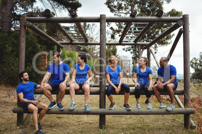 Fit people sitting on the obstacle couse