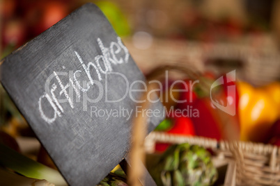 Close-up of placard with artichokes word in organic section