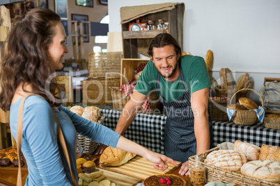 Customer interacting with staff at counter