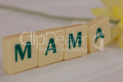 Close-up of blocks displaying mama message