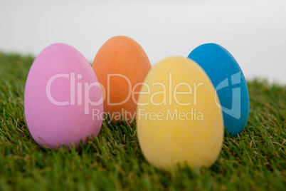 Painted Easter eggs arranged on grass