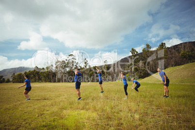 Fit people performing stretching exercise