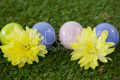 Multicolored Easter egg on grass