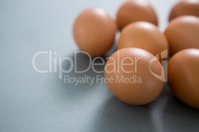 Brown eggs on grey background