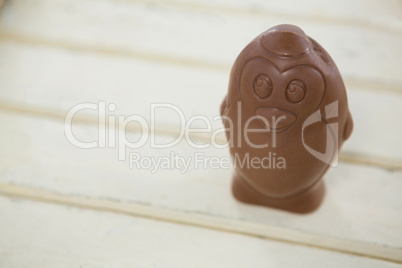 Chocolate Easter egg on wooden plank
