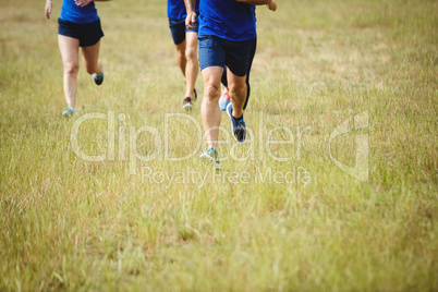 Fit people running in boot camp