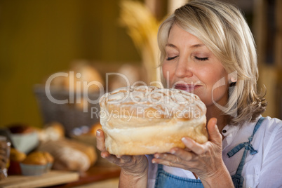 Female staff smelling a sweet food